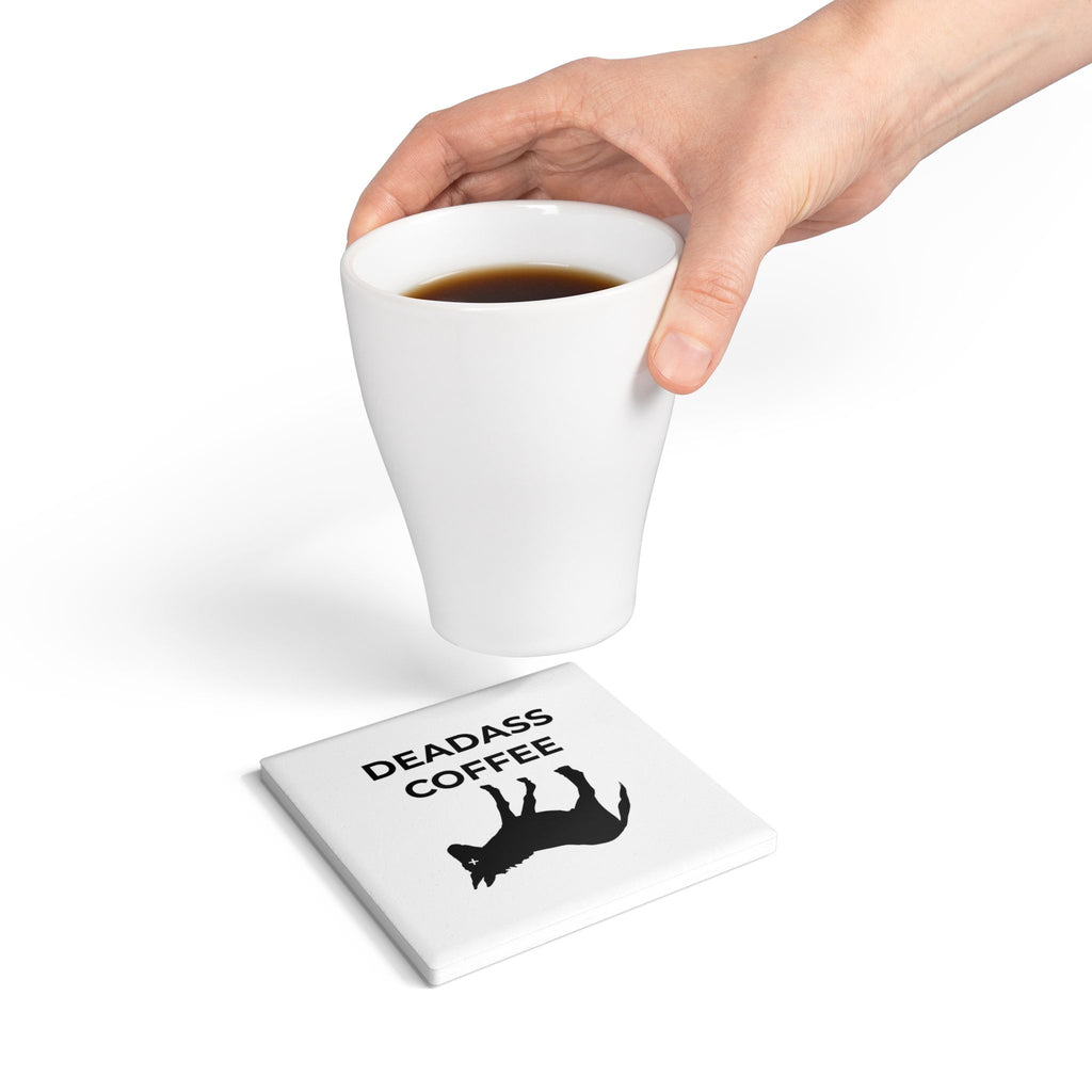Hand placing cup of coffee onto square Deadass Coaster