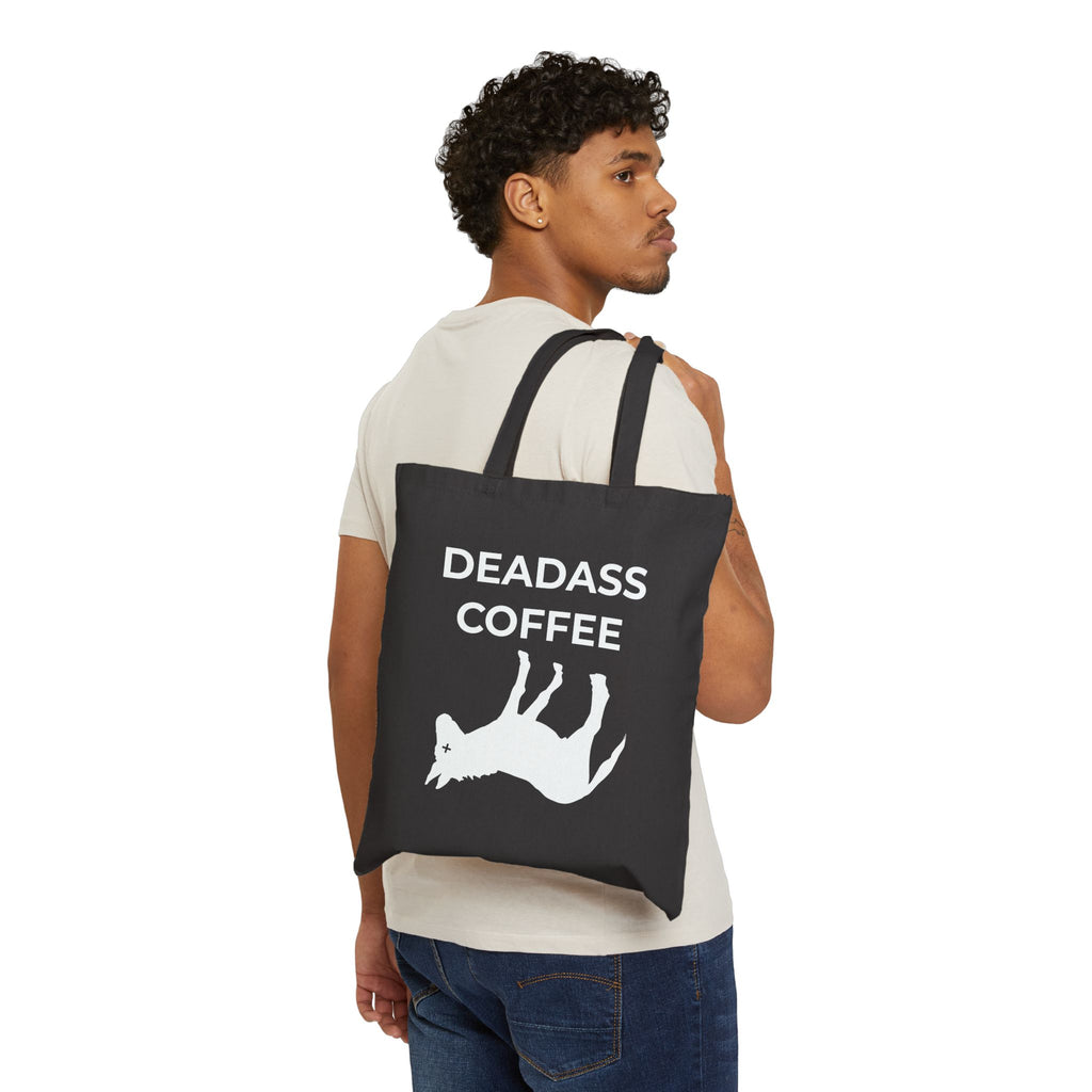 Man with black Deadass Tote over shoulder